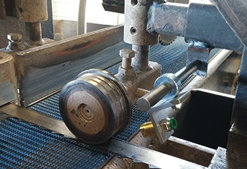 LubeMaster nozzle mount with guard (custom fabrication).