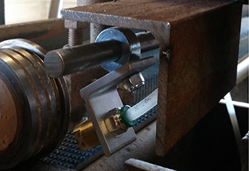 LubeMaster nozzle mount with guard (custom fabrication).