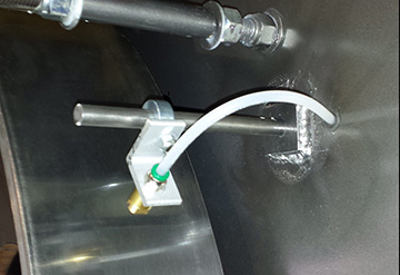 Mounting spray bars on a West Plains Resaw. Mounting spray bars on a West Plains Resaw